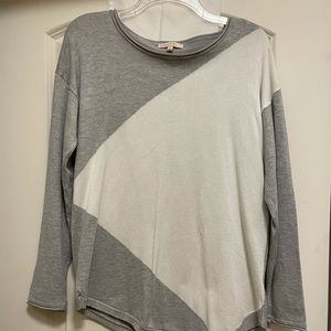 Gray and white color blocked long sleeve women’s Tee.